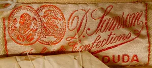Label met tekst D. Samson / Robes & Confections / Gouda