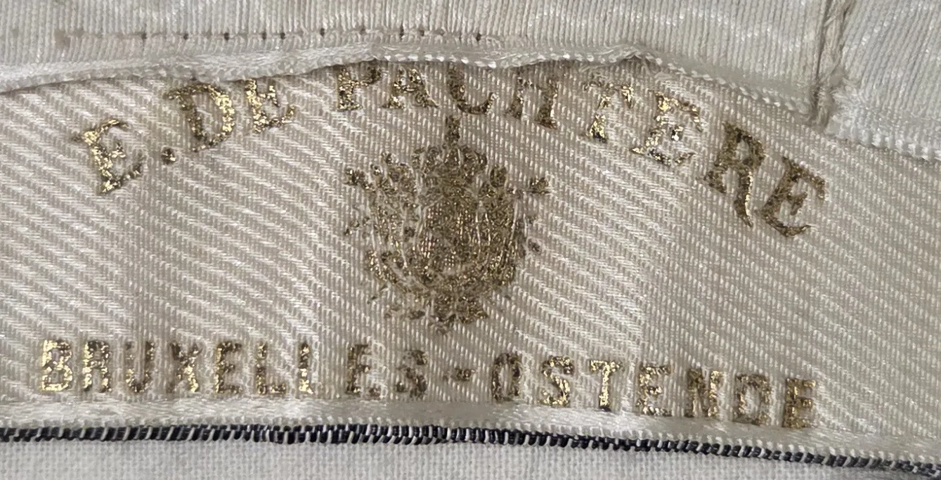 Etiquette avec texte E. DE PACHTERE / Bruxelles-Ostende
