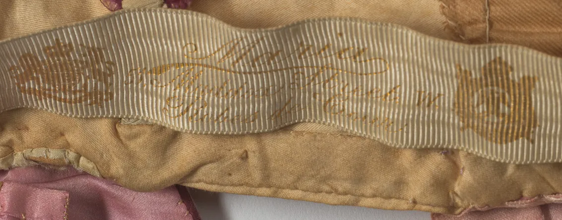 Label with textMaria / Maddox Street W. / Robes de Cour