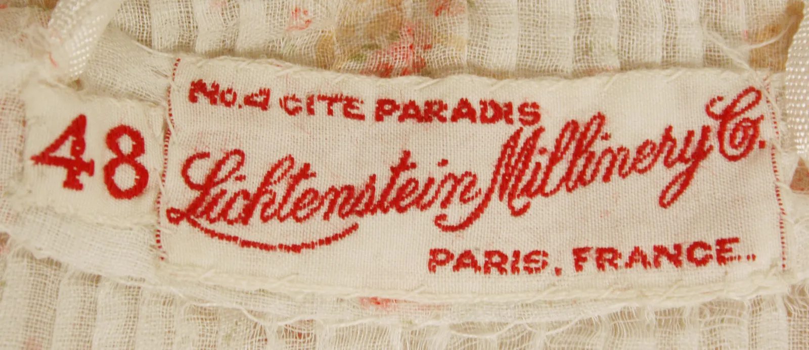 Label with textNo. 4 CITE PARADIS / Lichtenstein Millinery Co. / PARIS, FRANCE