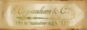 Label met tekst E. Coguenhem & Cie, 28 rue du Quatre September, Paris