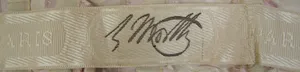 Label met tekst C. Worth, Paris