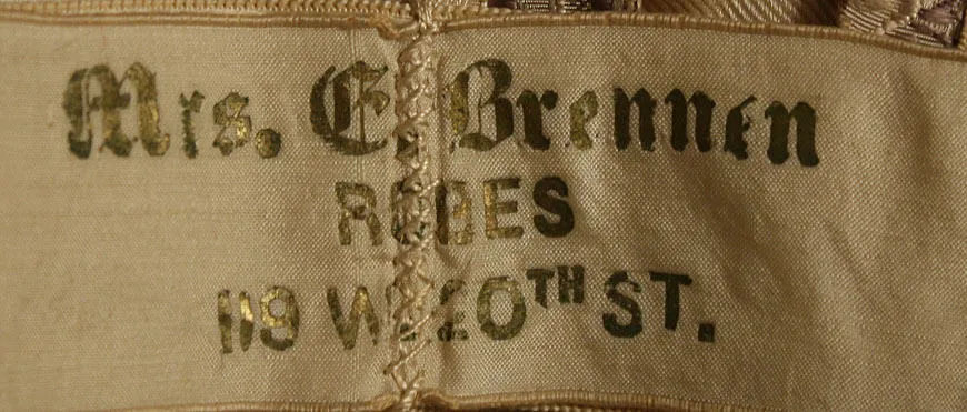 Label with textMrs. E. Brennen / ROBES / 119 W. 20TH ST.