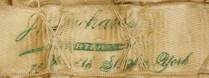 Label met tekst J. Richards (?) Importer … New York