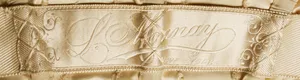 Label met tekst L. Monnay / New York