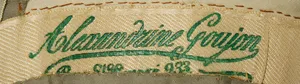 Label met tekst Alexandrine Goujon / Rue St. Honoré /  233