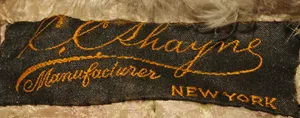 Label met tekst C.C. Shayne/ Manufacturer / New York