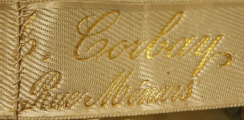 Etiquette avec texte A. Corbay/4 Rue Ménars