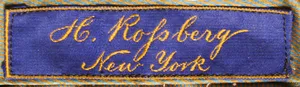 Label met tekst H. Rossberg / New York