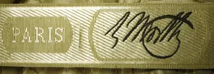 Label met tekst C. Worth, Paris