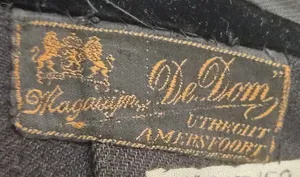 Label met tekst Magazijn De Dom / Utrecht / Amersfoort
