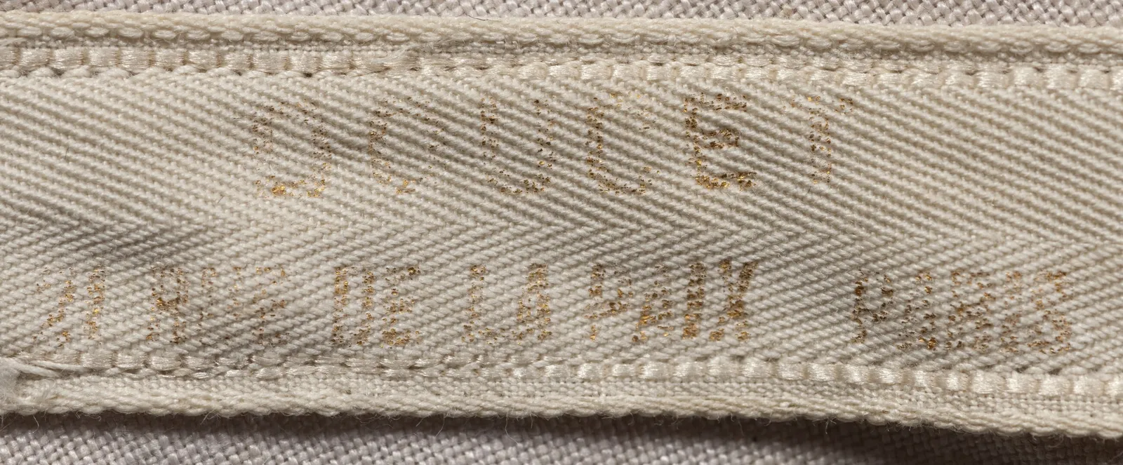 Label with textDoucet / 21, rue de la Paix / PARIS