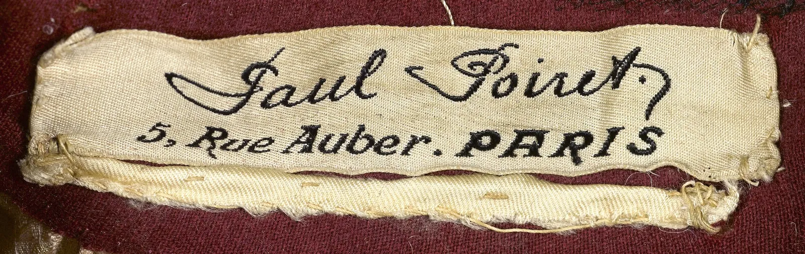Label with textPaul Poiret. / 5, Rue Auber. PARIS