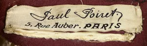 Label met tekst Paul Poiret. / 5, Rue Auber. PARIS